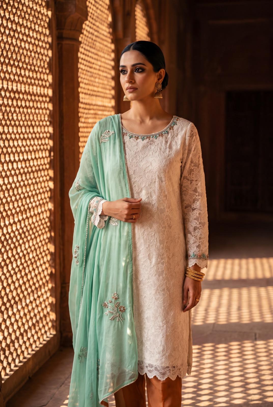Ivory corded floral lace kurta over caramel slip with mint chiffon dupatta and trousers