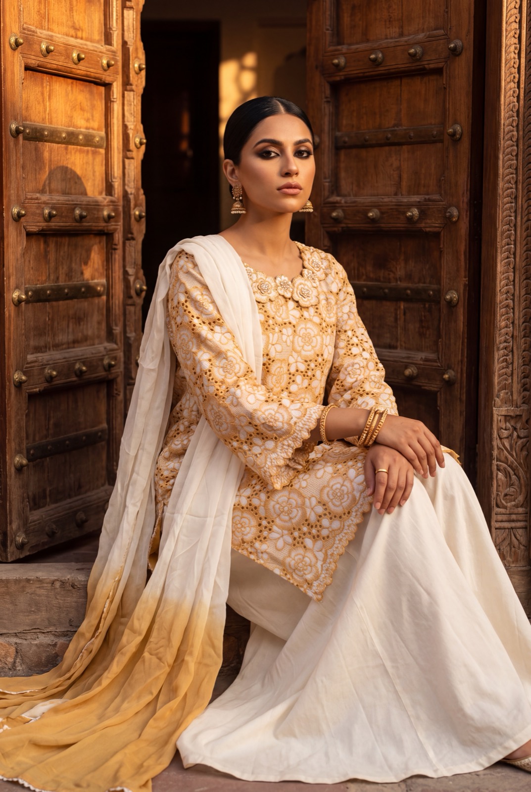 Golden mustard guipure lace kurta over ivory lining with ombre chiffon dupatta and trousers