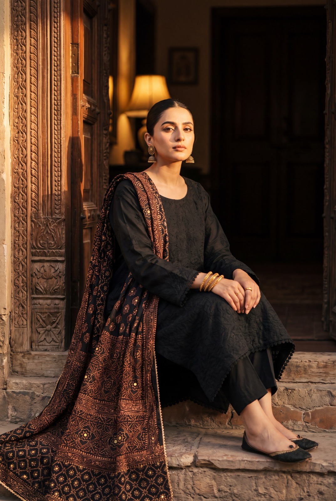 Black chikankari kurta with rust block-printed dupatta and trousers